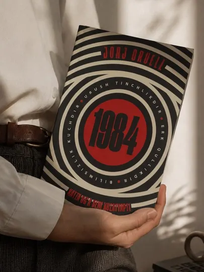 Книга 1984 — Джордж Оруэлл, политический роман, книга на узбекском языке