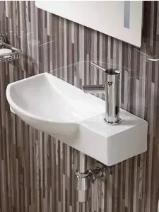CeramaLux Раковина подвесная 7947CL левосторонняя 50,5x24,5 см, белая